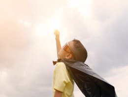 young boy looks skyward