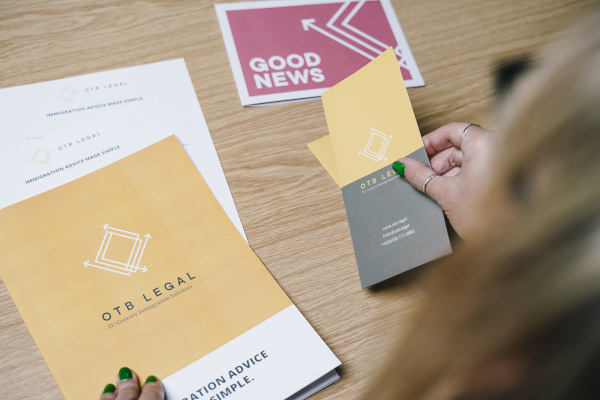 otb legal branded leaflets held by sally