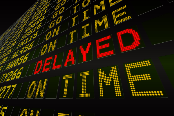 light board that says on time in yellow and delayed in red