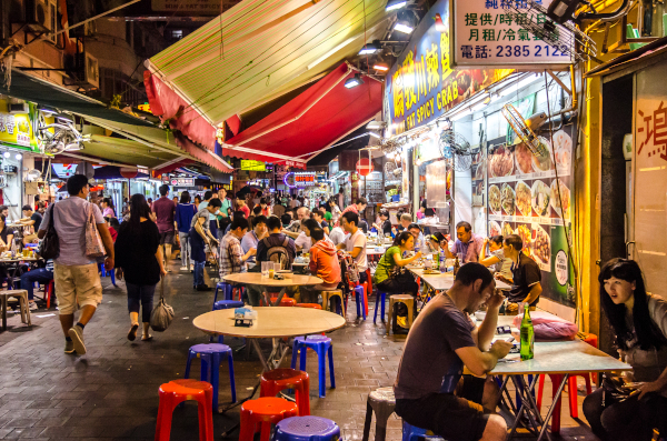 Hong Kong cafe on a busy street at night
